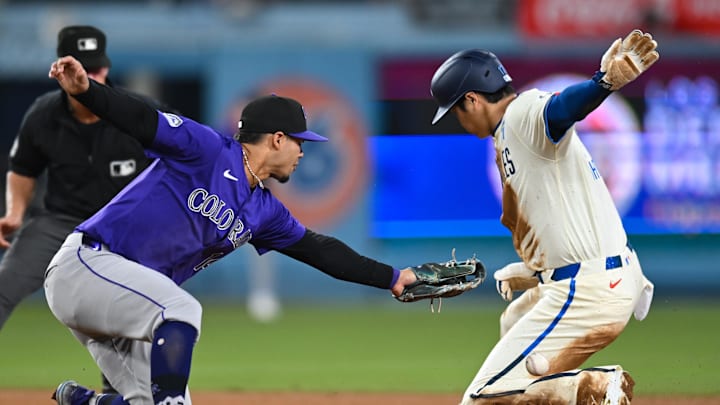 Los Angeles Dodgers designated hitter Shohei Ohtani (17) steals second base against Colorado Rockies shortstop Ezequiel Tovar (14) during the ninth inning at Dodger Stadium on Sept 21.