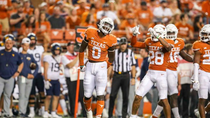Texas Longhorns linebacker DeMarvion Overshown celebrates following a defensive stop during the fourth quarter
