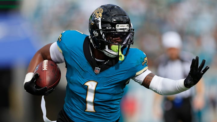 Jacksonville Jaguars running back Travis Etienne Jr. rushes during a game.