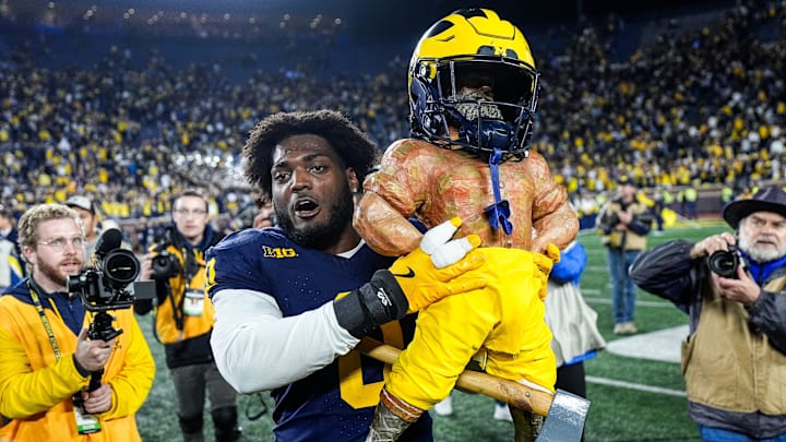 Michigan defensive end Josaiah Stewart (0) lifts the Paul Bunyan Trophy after 24-17 win over Michigan State at Michigan Stadium in Ann Arbor on Saturday, Oct. 26, 2024. Michigan defensive end Josaiah Stewart (0) lifts the Paul Bunyan Trophy after 24-17 win over Michigan State at Michigan Stadium in Ann Arbor on Saturday, Oct. 26, 2024.