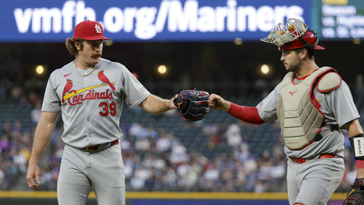 Sep 8, 2025; Seattle, Washington, USA; St. Louis Cardinals starting pitcher Miles Mikolas (39) bumps fists with catcher Jimmy Crooks (8) following the third inning against the Seattle Mariners at T-Mobile Park. Mandatory Credit: Joe Nicholson-Imagn Images Sep 8, 2025; Seattle, Washington, USA; St. Louis Cardinals starting pitcher Miles Mikolas (39) bumps fists with catcher Jimmy Crooks (8) following the third inning against the Seattle Mariners at T-Mobile Park. Mandatory Credit: Joe Nicholson-Imagn Images