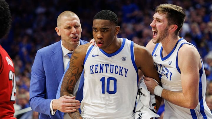 Dec 14, 2024; Lexington, Kentucky, USA; Kentucky Wildcats head coach Mark Pope and forward Andrew Carr (7) celebrate with forward Brandon Garrison (10) during the second half against the Louisville Cardinals at Rupp Arena at Central Bank Center. Mandatory Credit: Jordan Prather-Imagn Images