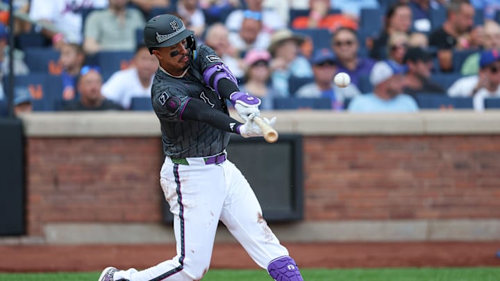 Jul 20, 2025; New York City, New York, USA; New York Mets third baseman Mark Vientos (27) singles during the second inning against the Cincinnati Reds at Citi Field. Mandatory Credit: Vincent Carchietta-Imagn Images