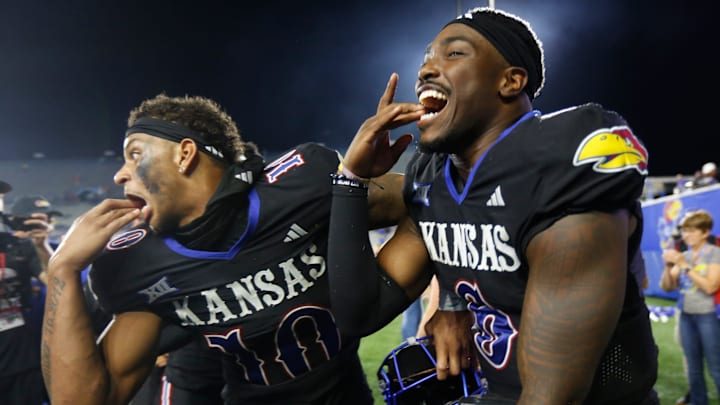 Kansas Jayhawks quarterback Jalon Daniels (6) and Kansas Jayhawks wide receiver Levi Wentz (10) celebrate their win after the game against West Virginia Mountaineers at David Booth Kansas Memorial Stadium on Sept. 20, 2025.