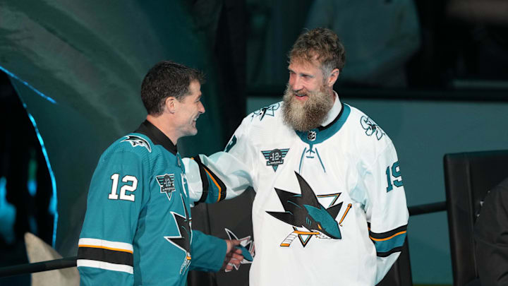 Feb 25, 2023; San Jose, California, USA; San Jose Sharks former player Patrick Marleau talks to former player Joe Thornton during his jersey retirement ceremony before the game against the Chicago Blackhawks at SAP Center at San Jose. Mandatory Credit: Darren Yamashita-Imagn Images