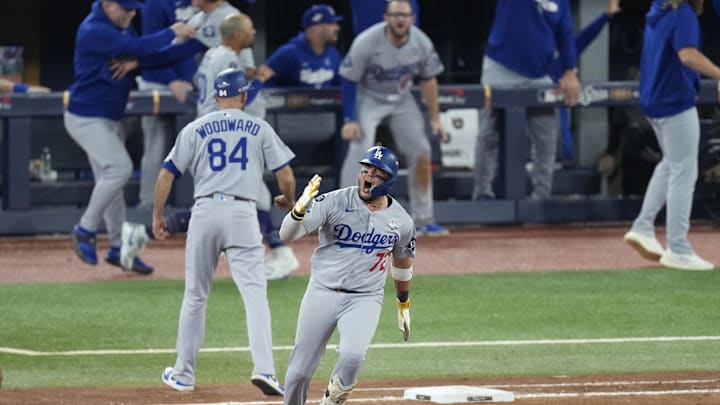 Nov 1, 2025; Toronto, Ontario, CAN; Los Angeles Dodgers second baseman Miguel Rojas (72) celebrates as he runs the bases after hitting a home run against the Toronto Blue Jays in the ninth inning during game seven of the 2025 MLB World Series at Rogers Centre. Mandatory Credit: Kevin Sousa-Imagn Images