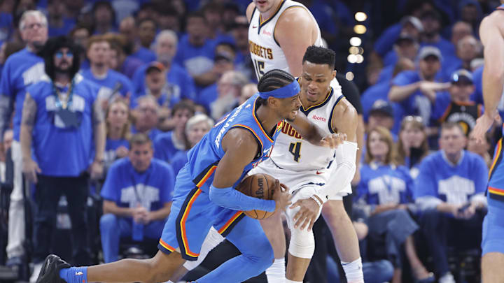May 18, 2025; Oklahoma City, Oklahoma, USA; Oklahoma City Thunder guard Shai Gilgeous-Alexander (2) is fouled by Denver Nuggets guard Russell Westbrook (4) on a drive in the second quarter during game seven of the second round for the 2025 NBA Playoffs at Paycom Center. Mandatory Credit: Alonzo Adams-Imagn Images May 18, 2025; Oklahoma City, Oklahoma, USA; Oklahoma City Thunder guard Shai Gilgeous-Alexander (2) is fouled by Denver Nuggets guard Russell Westbrook (4) on a drive in the second quarter during game seven of the second round for the 2025 NBA Playoffs at Paycom Center. Mandatory Credit: Alonzo Adams-Imagn Images