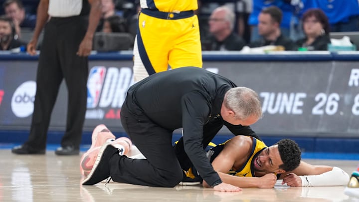 Jun 22, 2025; Oklahoma City, Oklahoma, USA; Indiana Pacers guard Tyrese Haliburton (0) reacts after suffering an injury during the first quarter against the Oklahoma City Thunder during game seven of the 2025 NBA Finals at Paycom Center. Mandatory Credit: Kyle Terada-Imagn Images