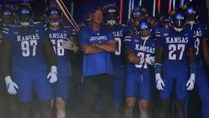 Kansas Jayhawks head coach Lance Leipold brings his team out before the game between Fresno State and Kansas at David Booth Kansas Memorial Stadium.