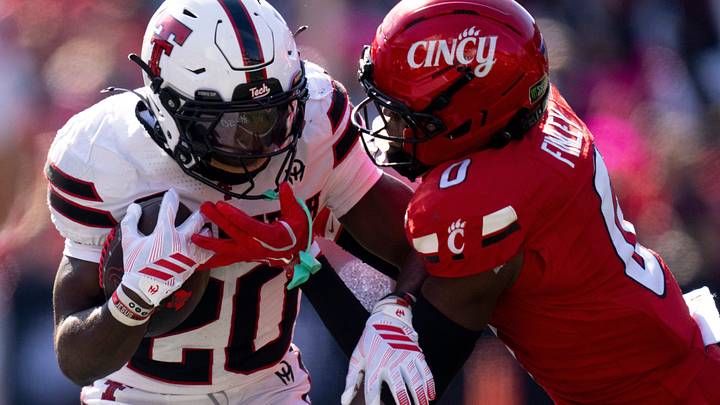 Cincinnati Bearcats cornerback Jacob Finley (0) tackles Texas Tech Red Raiders running back I'Koby Williams (20) in the third quarter of the Big 12 game between Cincinnati Bearcats and Texas Tech at Nippert Stadium in Cincinnati on Saturday, October 24, 2026. Cincinnati Bearcats cornerback Jacob Finley (0) tackles Texas Tech Red Raiders running back I'Koby Williams (20) in the third quarter of the Big 12 game between Cincinnati Bearcats and Texas Tech at Nippert Stadium in Cincinnati on Saturday, October 24, 2026.
