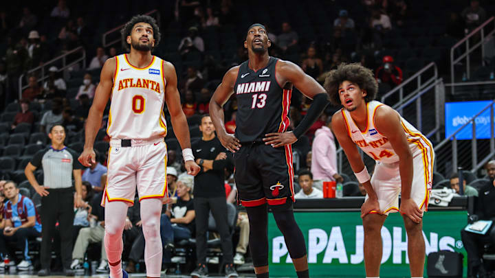 Oct 13, 2025; Atlanta, Georgia, USA; Atlanta Hawks forward Jacob Toppin (0) and forward Asa Newell (14) watch the free throw against Miami Heat center/forward Bam Adebayo (13) during the third quarter at State Farm Arena. Mandatory Credit: Jordan Godfree-Imagn Images Oct 13, 2025; Atlanta, Georgia, USA; Atlanta Hawks forward Jacob Toppin (0) and forward Asa Newell (14) watch the free throw against Miami Heat center/forward Bam Adebayo (13) during the third quarter at State Farm Arena. Mandatory Credit: Jordan Godfree-Imagn Images