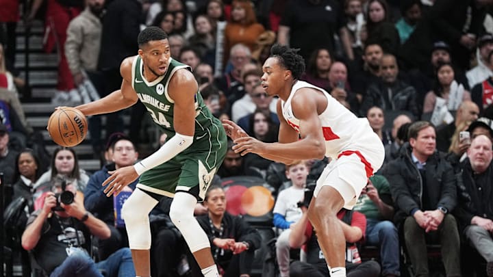 Jan 6, 2025; Toronto, Ontario, CAN; Milwaukee Bucks forward Giannis Antetokounmpo (34) controls the ball as Toronto Raptors forward Scottie Barnes (4) defends during the third quarter at Scotiabank Arena. Mandatory Credit: Nick Turchiaro-Imagn Images Jan 6, 2025; Toronto, Ontario, CAN; Milwaukee Bucks forward Giannis Antetokounmpo (34) controls the ball as Toronto Raptors forward Scottie Barnes (4) defends during the third quarter at Scotiabank Arena. Mandatory Credit: Nick Turchiaro-Imagn Images