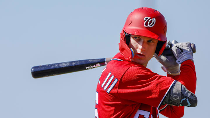 Feb 20, 2023; West Palm Beach, FL, USA; Washington Nationals outfielder Robert Hassell III (55) practices his swing during a spring training workout at The Ballpark of the Palm Beaches. 