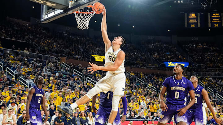 Michigan center Vladislav Goldin (50) attempts a dunk against Washington during the second half at Crisler Center in Ann Arbor on Sunday, Jan. 12, 2025. Michigan center Vladislav Goldin (50) attempts a dunk against Washington during the second half at Crisler Center in Ann Arbor on Sunday, Jan. 12, 2025.