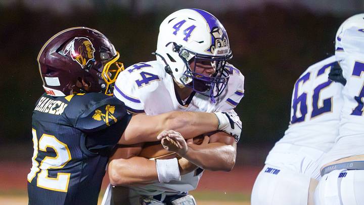 East Peoria’s Ryan Hansen (32) wraps up Canton’s Caleb Jochums in the first half of their high school football game Friday, Sept. 18, 2026 in East Peoria. The Raiders defeated the Little Giants 26-20 in overtime. East Peoria’s Ryan Hansen (32) wraps up Canton’s Caleb Jochums in the first half of their high school football game Friday, Sept. 18, 2026 in East Peoria. The Raiders defeated the Little Giants 26-20 in overtime.