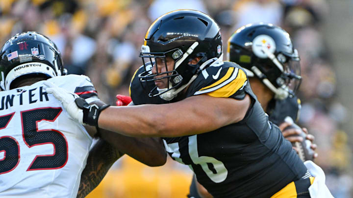 Aug 9, 2024; Pittsburgh, Pennsylvania, USA;  Pittsburgh Steelers offensive tackle Troy Fautanu (76) blocks Houston Texans defensive end Danielle Hunter (55) during the first quarter at Acrisure Stadium. Mandatory Credit: Barry Reeger-Imagn Images