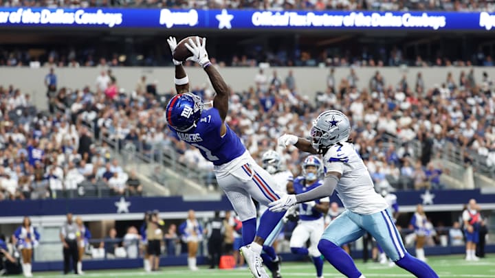 Sep 14, 2025; Arlington, Texas, USA; New York Giants wide receiver Malik Nabers (1) makes a catch for a touchdown against Dallas Cowboys cornerback Trevon Diggs (7) during the second quarter at AT&T Stadium. Sep 14, 2025; Arlington, Texas, USA; New York Giants wide receiver Malik Nabers (1) makes a catch for a touchdown against Dallas Cowboys cornerback Trevon Diggs (7) during the second quarter at AT&T Stadium.