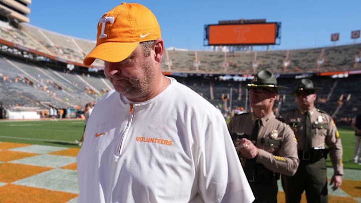Tennessee football coach Josh Heupel walks off the field followed by his security detail after the win over UAB in an NCAA college football game on September 20, 2025, in Knoxville, Tennessee.