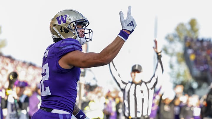 Huskies wide receiver Denzel Boston celebrates a touchdown catch against the Michigan Wolverines. Huskies wide receiver Denzel Boston celebrates a touchdown catch against the Michigan Wolverines.