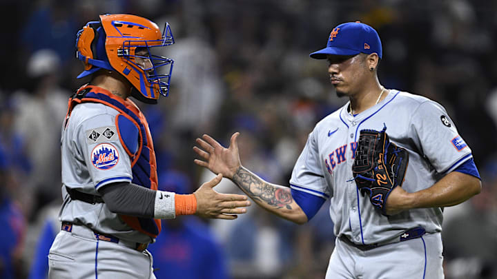 Aug 24, 2024; San Diego, California, USA; New York Mets relief pitcher Dedniel Nunez (72) and catcher Francisco Alvarez (4) celebrate on the field after defeating the San Diego Padres at Petco Park. Mandatory Credit: Orlando Ramirez-Imagn Images