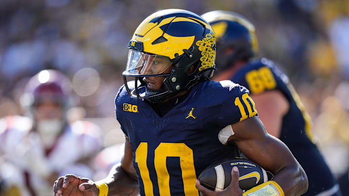 Michigan quarterback Alex Orji (10) keeps the ball for a run against USC during the first half at Michigan Stadium in Ann Arbor on Saturday, Sept. 21, 2024.