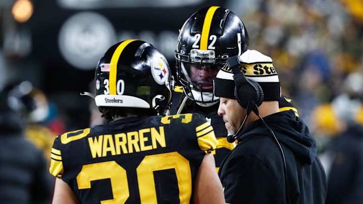 Dec 7, 2023; Pittsburgh, Pennsylvania, USA;  Pittsburgh Steelers running backs Jaylen Warren (30) and Najee Harris (22) talk with running backs coach Eddie Faulkner (right) on the sidelines against the New England Patriots during the third quarter at Acrisure Stadium. Mandatory Credit: Charles LeClaire-Imagn Images