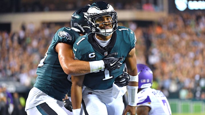 Sep 19, 2022; Philadelphia, Pennsylvania, USA; Philadelphia Eagles quarterback Jalen Hurts (1) celebrates his 26-yard touchdown run with tight end Dallas Goedert (88) against the Minnesota Vikings during the second quarter at Lincoln Financial Field. Mandatory Credit: Eric Hartline-Imagn Images