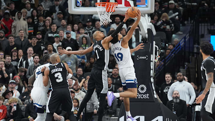 Jan 17, 2026; San Antonio, Texas, USA; San Antonio Spurs forward Victor Wembanyama (1) blocks a shot by Minnesota Timberwolves forward Joan Beringer (19) in the second half at Frost Bank Center.