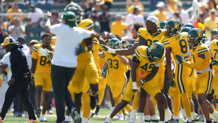 The Baylor Bears celebrate after blocking a field goal attempt against the Kansas State Wildcats at the end of the second half at McLane Stadium