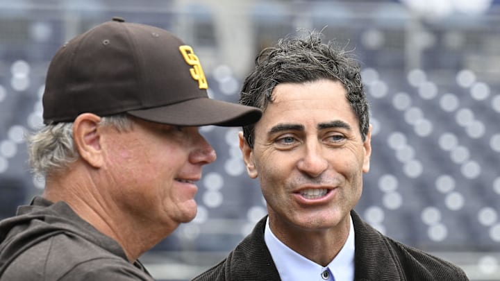Mar 27, 2025; San Diego, California, USA; San Diego Padres general manager A.J. Preller, right, talks with manager Mike Shildt before an Opening Day baseball game between the San Diego Padres and the Atlanta Braves at Petco Park. Mandatory Credit: Denis Poroy-Imagn Images
