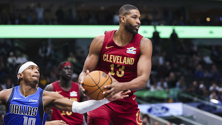 Jan 3, 2025; Dallas, Texas, USA; Cleveland Cavaliers center Tristan Thompson (13) grabs a rebound past Dallas Mavericks guard Brandon Williams (10) during the fourth quarter at American Airlines Center. Mandatory Credit: Kevin Jairaj-Imagn Images