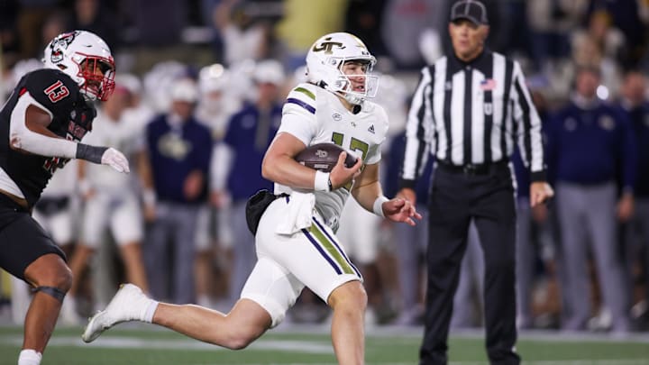 Nov 21, 2024; Atlanta, Georgia, USA; Georgia Tech Yellow Jackets quarterback Aaron Philo (12) runs the ball for a touchdown against the North Carolina State Wolfpack in the fourth quarter at Bobby Dodd Stadium at Hyundai Field. Mandatory Credit: Brett Davis-Imagn Images