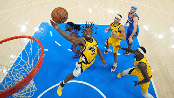 Jun 22, 2025; Oklahoma City, Oklahoma, USA; Indiana Pacers forward Aaron Nesmith (23) reaches for the ball against the Oklahoma City Thunder during the first half of game seven of the 2025 NBA Finals at Paycom Center. Mandatory Credit: Kyle Terada-Imagn Images