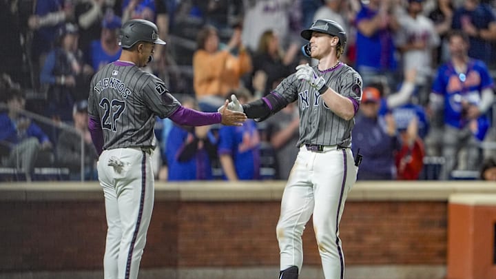 May 10, 2025; New York City, New York, USA; New York Mets designated hitter Mark Vientos (27) congratulates  third baseman Brett Baty (7) for hitting a two run home run against the Chicago Cubs during the eighth inning at Citi Field. Mandatory Credit: Gregory Fisher-Imagn Images