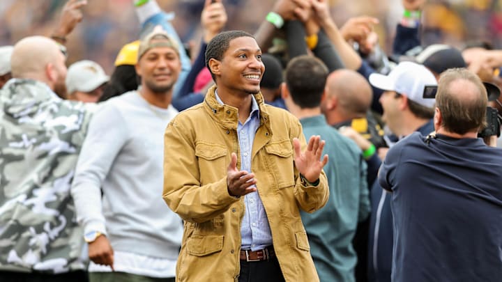 Oct 28, 2017; Morgantown, WV, USA; West Virginia Mountaineers former quarterback Pat White is honored with the 2007 Mountaineer football team during the first half at Milan Puskar Stadium. Mandatory Credit: Ben Queen-Imagn Images