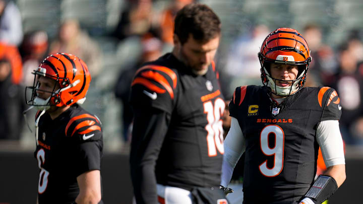 Cincinnati Bengals quarterback Joe Burrow (9) and the quarterbacks warmup before the first quarter of the NFL Week 18 game between the Cincinnati Bengals and the Cleveland Browns at Paycor Stadium in Downtown Cincinnati on Sunday, Jan. 4, 2026.