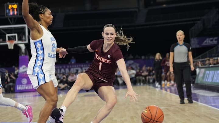Mar 6, 2026; Duluth, Ga.; Virginia Tech Hokies guard Carleigh Wenzel (1) loses the ball after colliding with North Carolina guard Indya Nivar (24).