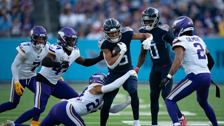 Tennessee Titans wide receiver Nick Westbrook-Ikhine (15) runs after a catch into the teeth of the Minnesota Vikings defense in the second half at Nissan Stadium in Nashville, Tenn., Sunday, Nov. 17, 2024. Tennessee Titans wide receiver Nick Westbrook-Ikhine (15) runs after a catch into the teeth of the Minnesota Vikings defense in the second half at Nissan Stadium in Nashville, Tenn., Sunday, Nov. 17, 2024.