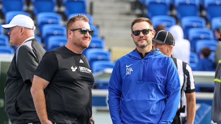 Memphis, Tennessee, USA; South Florida Bulls head coach Alex Goulash talks with Memphis Tigers head coach Ryan Silverfield before the game at Simmons Bank Liberty Stadium.