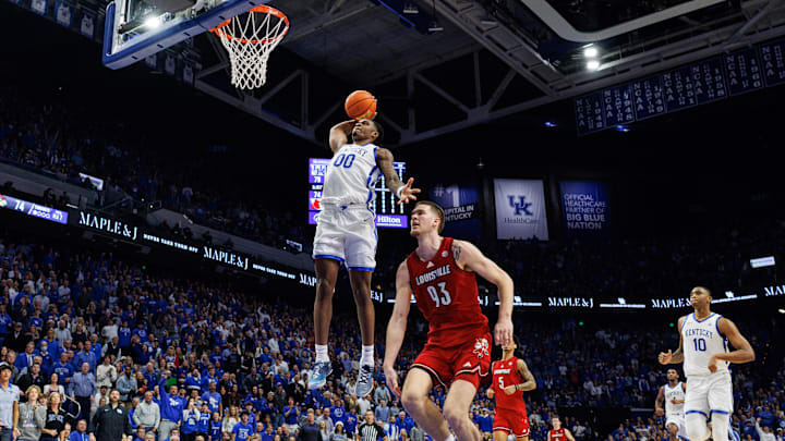 Kentucky Wildcats guard Otega Oweh dunks the ball against the Louisville Cardinals at Rupp Arena.