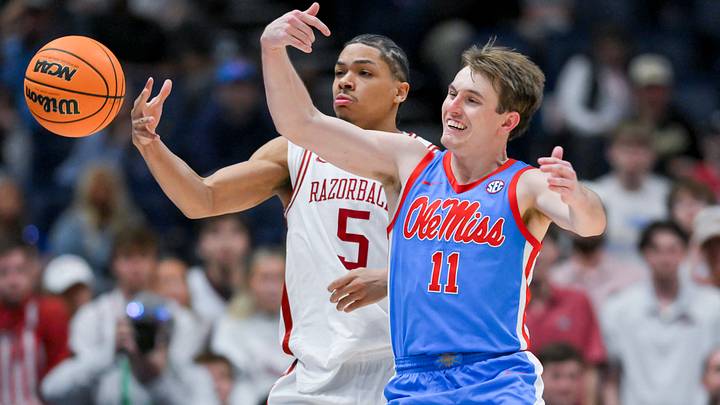 Mar 14, 2026; Nashville, TN, USA; Mississippi Rebels guard Travis Perry (11) knocks the ball out of bounds from the hands of Arkansas Razorbacks guard Darius Acuff Jr. (5) during the second half at Bridgestone Arena. Mandatory Credit: Steve Roberts-Imagn Images Mar 14, 2026; Nashville, TN, USA; Mississippi Rebels guard Travis Perry (11) knocks the ball out of bounds from the hands of Arkansas Razorbacks guard Darius Acuff Jr. (5) during the second half at Bridgestone Arena. Mandatory Credit: Steve Roberts-Imagn Images