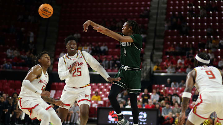 Nov 4, 2024; College Park, Maryland, USA; Manhattan Jaspers forward Will Sydnor (9) makes a pass over Maryland Terrapins guard DeShawn Harris-Smith (5), Maryland Terrapins center Derik Queen (25) and Maryland Terrapins guard Selton Miguel (9) during the first half at Xfinity Center. Mandatory Credit: Daniel Kucin Jr.-Imagn Images Nov 4, 2024; College Park, Maryland, USA; Manhattan Jaspers forward Will Sydnor (9) makes a pass over Maryland Terrapins guard DeShawn Harris-Smith (5), Maryland Terrapins center Derik Queen (25) and Maryland Terrapins guard Selton Miguel (9) during the first half at Xfinity Center. Mandatory Credit: Daniel Kucin Jr.-Imagn Images