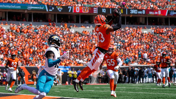 Cincinnati Bengals cornerback Dax Hill (23) intercepts a pass intended for Jacksonville Jaguars wide receiver Travis Hunter (12) in the first quarter of the NFL Week 2 game between the Cincinnati Bengals and the Jacksonville Jaguars at Paycor Stadium in downtown Cincinnati on Sunday, Sept. 14, 2025. Cincinnati Bengals cornerback Dax Hill (23) intercepts a pass intended for Jacksonville Jaguars wide receiver Travis Hunter (12) in the first quarter of the NFL Week 2 game between the Cincinnati Bengals and the Jacksonville Jaguars at Paycor Stadium in downtown Cincinnati on Sunday, Sept. 14, 2025.