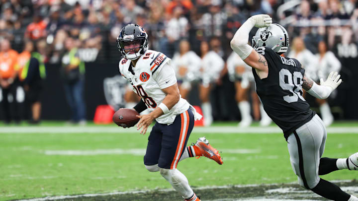 Bears quarterback Caleb Williams (18) looks for an open receiver against the Raiders. Bears quarterback Caleb Williams (18) looks for an open receiver against the Raiders.