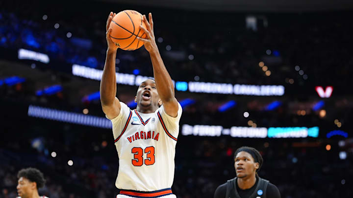 Mar 20, 2026; Philadelphia, PA, USA; Virginia Cavaliers center Ugonna Onyenso (33) grabs a rebound during the first half against the Wright State Raiders during a first round game of the men's 2026 NCAA Tournament at Xfinity Mobile Arena. Mandatory Credit: Kyle Ross-Imagn Images