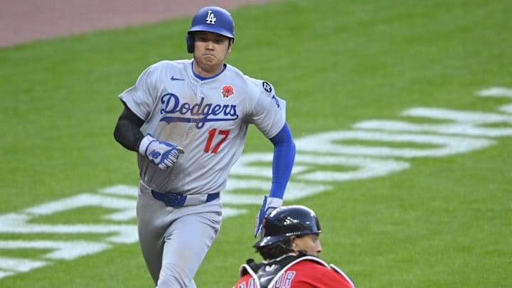 May 26, 2025; Cleveland, Ohio, USA; Los Angeles Dodgers designated hitter Shohei Ohtani (17) runs beside Cleveland Guardians catcher Bo Naylor (23) while scoring in the sixth inning at Progressive Field. Mandatory Credit: David Richard-Imagn Images May 26, 2025; Cleveland, Ohio, USA; Los Angeles Dodgers designated hitter Shohei Ohtani (17) runs beside Cleveland Guardians catcher Bo Naylor (23) while scoring in the sixth inning at Progressive Field. Mandatory Credit: David Richard-Imagn Images
