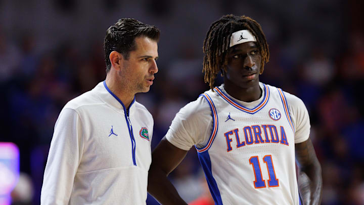 Jan 25, 2025; Gainesville, Florida, USA; Florida Gators head coach Todd Golden talks with Florida Gators guard Denzel Aberdeen (11) during a timeout against the Georgia Bulldogs during the second half at Exactech Arena at the Stephen C. O'Connell Center. Mandatory Credit: Matt Pendleton-Imagn Images