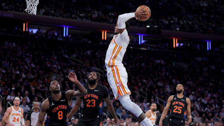 Apr 20, 2026; New York, New York, USA; Atlanta Hawks forward Jonathan Kuminga (0) dunks against New York Knicks forward OG Anunoby (8) and center Mitchell Robinson (23) and guard Mikal Bridges (25) during the fourth quarter of game two of the first round of the 2026 NBA Playoffs at Madison Square Garden. Mandatory Credit: Brad Penner-Imagn Images