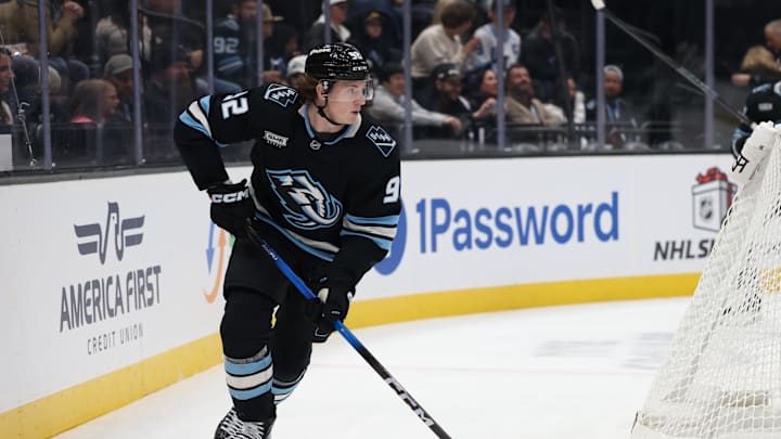 Nov 24, 2025; Salt Lake City, Utah, USA; Utah Mammoth center Logan Cooley (92) moves the puck against the Vegas Golden Knights during the first period at Delta Center. Mandatory Credit: Rob Gray-Imagn Images