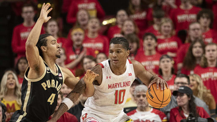 Maryland forward Julian Reese (10) dribbles as Purdue forward Trey Kaufman-Renn (4) defends during a game last year.